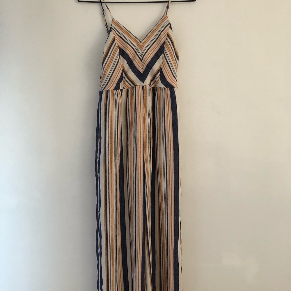 Flowy striped jumpsuit with adjustable straps.